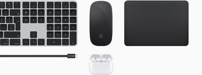 Collection of accessories including Magic Keyboard with Touch ID, Magic Mouse, Magic Track Pad, Thunderbolt 5 Pro cable, and AirPods Pro